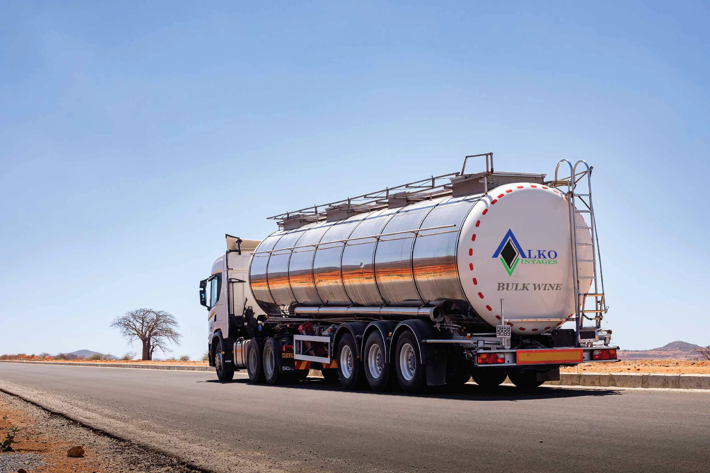 Alko bulk wine tanker travelling on an open East African road